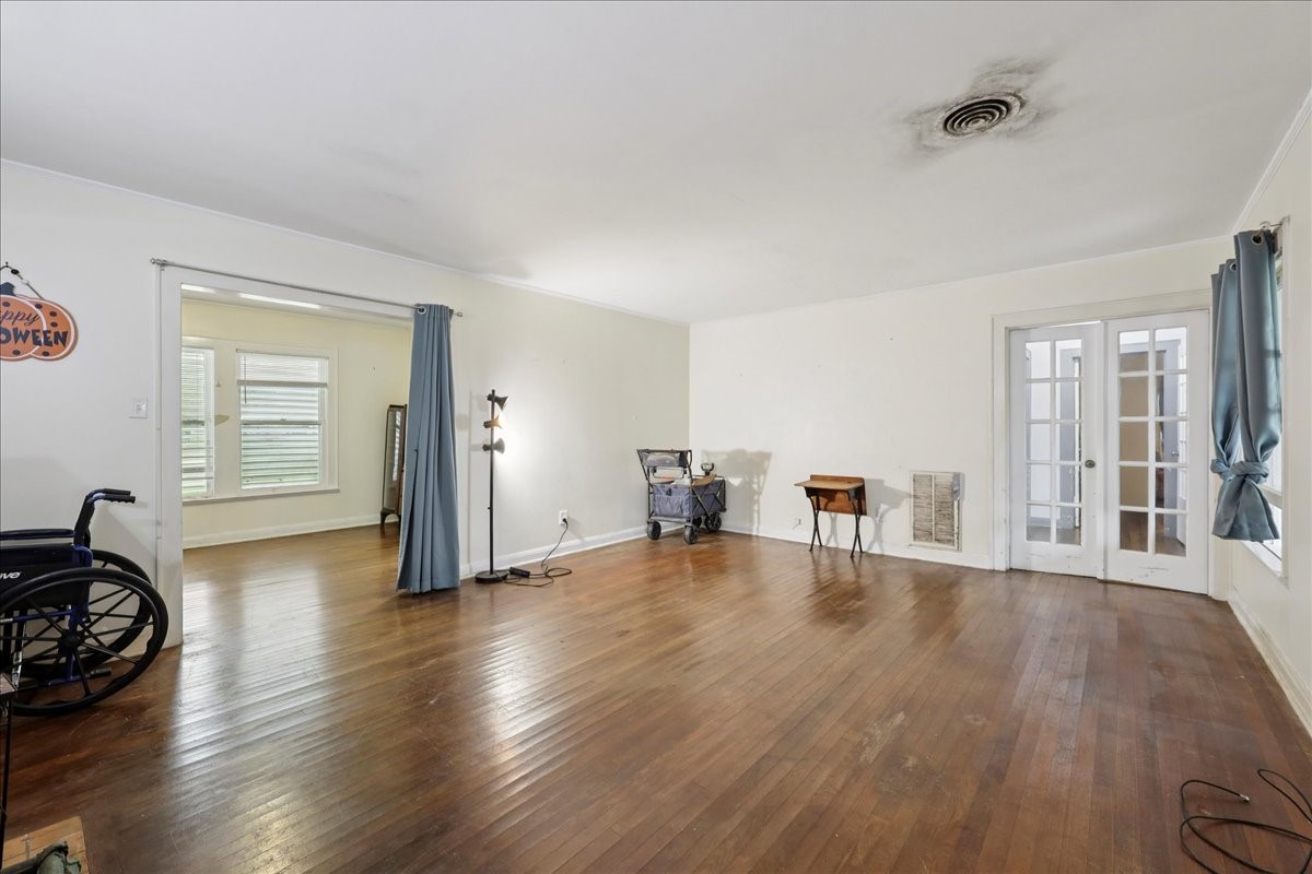 11910 Cedar Gully Road Beach City, TX 77523 - Photo 25 of 50 a view of a livingroom with wooden floor and a window