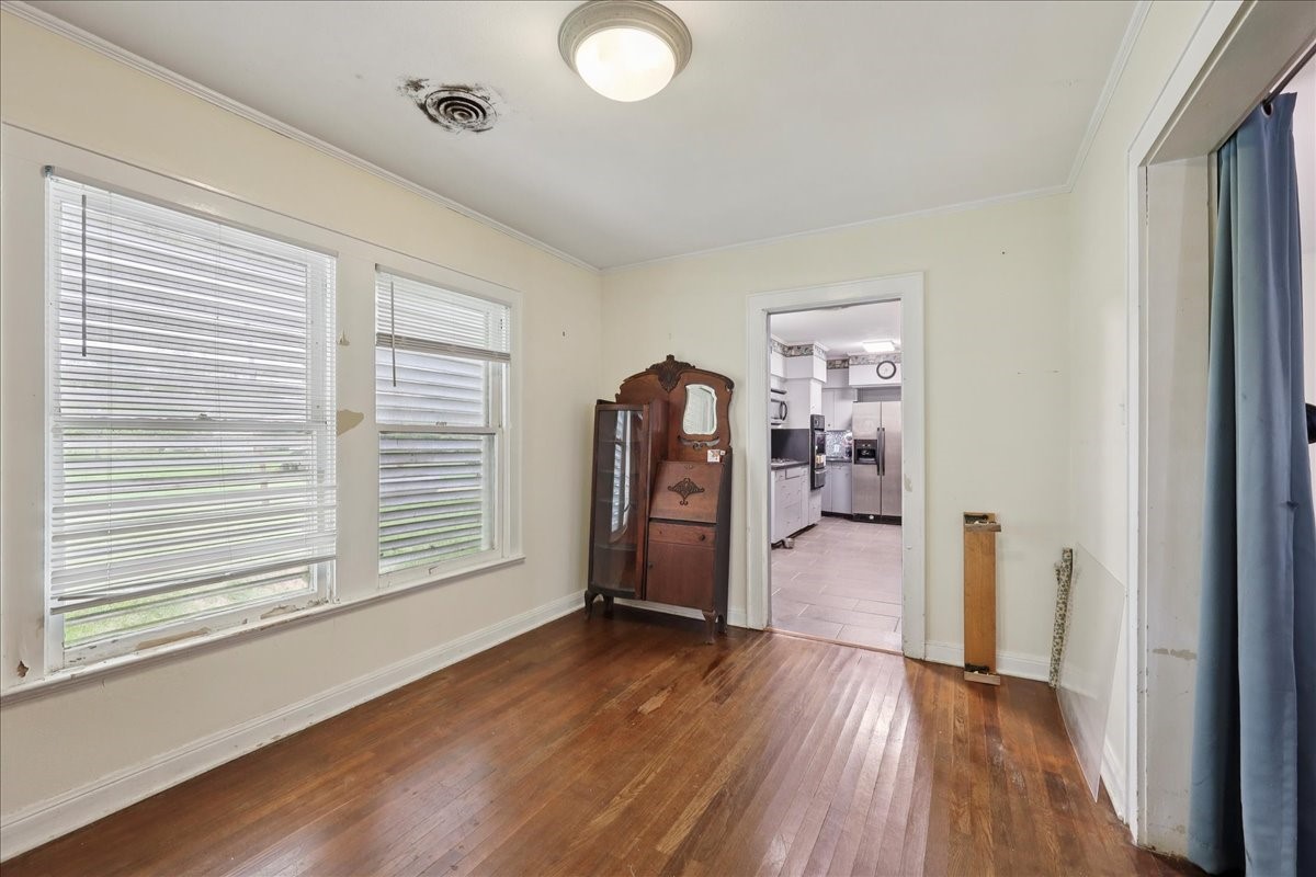 11910 Cedar Gully Road Beach City, TX 77523 - Photo 28 of 50 a view of a livingroom with wooden floor and a window