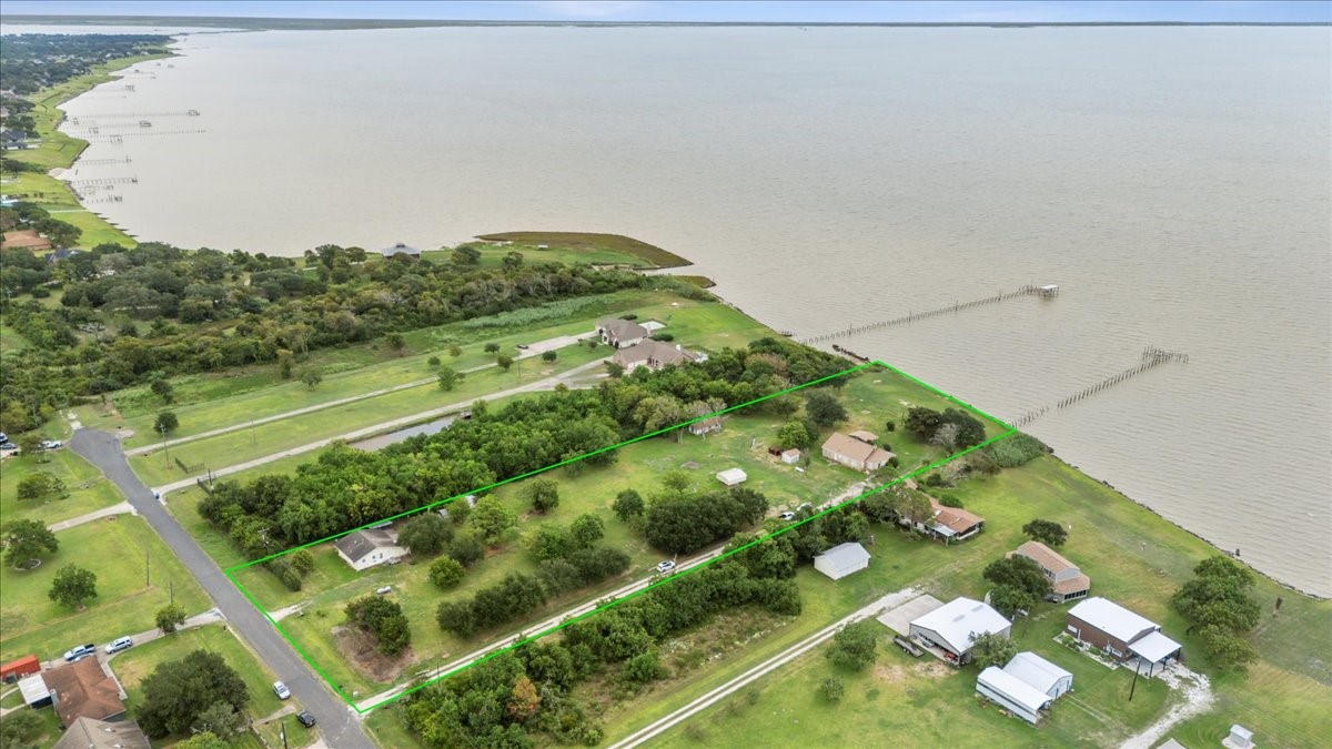 11910 Cedar Gully Road Beach City, TX 77523 - Photo 4 of 50 a view of a lake with a yard