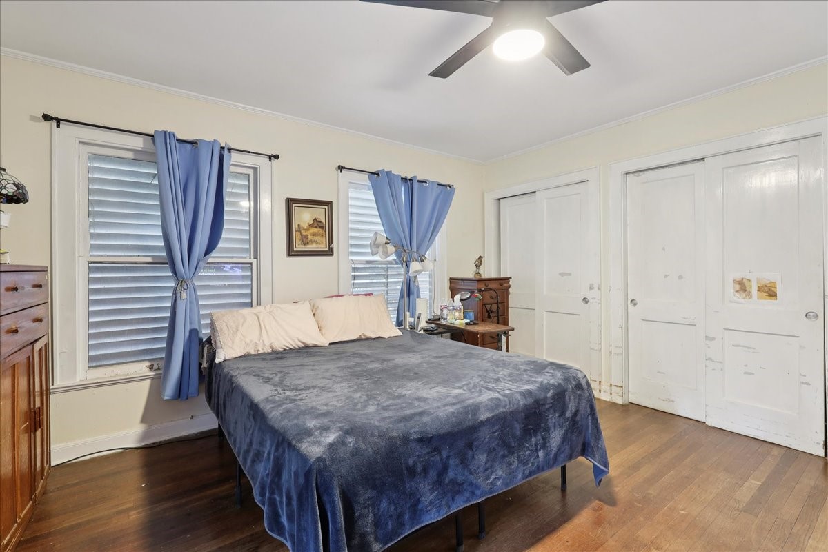 11910 Cedar Gully Road Beach City, TX 77523 - Photo 41 of 50 a bedroom with a bed and a dresser