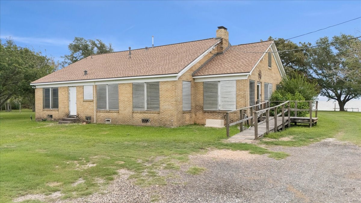 11910 Cedar Gully Road Beach City, TX 77523 - Photo 45 of 50 a view of a house with a yard