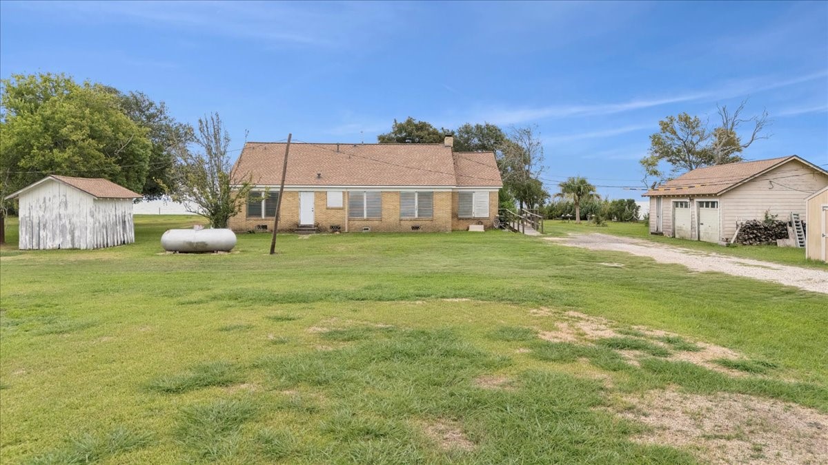 11910 Cedar Gully Road Beach City, TX 77523 - Photo 46 of 50 a bathroom with a sink and a yard