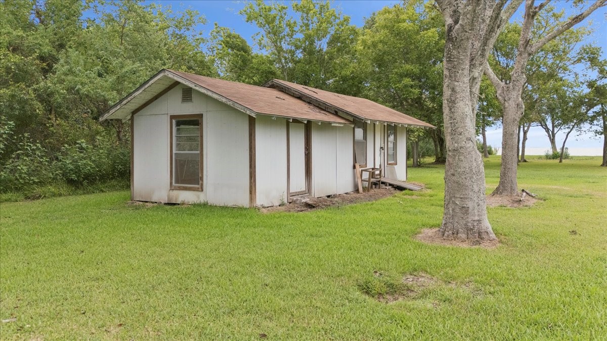 11910 Cedar Gully Road Beach City, TX 77523 - Photo 50 of 50 a view of a house with backyard and garden
