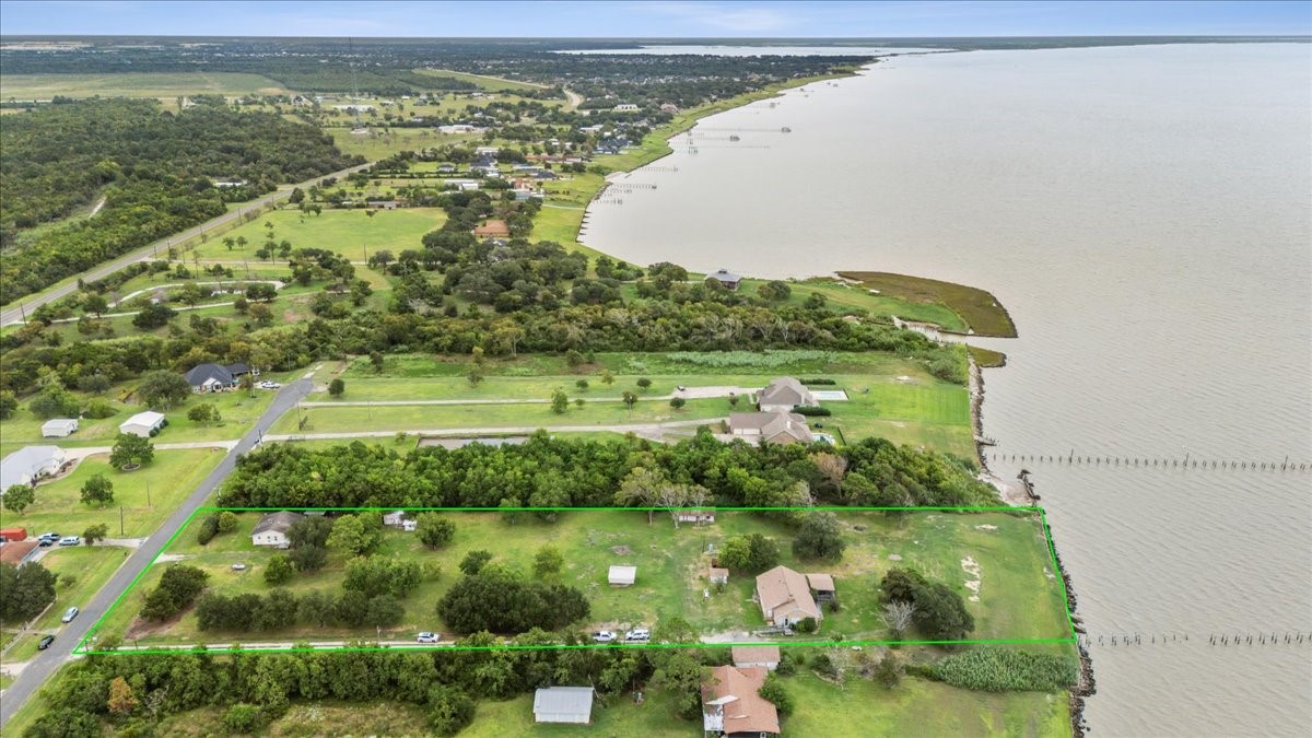 11910 Cedar Gully Road Beach City, TX 77523 - Photo 5 of 50 a view of a lake with a yard