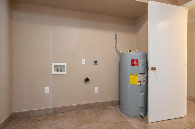 a view of an empty room with a fan