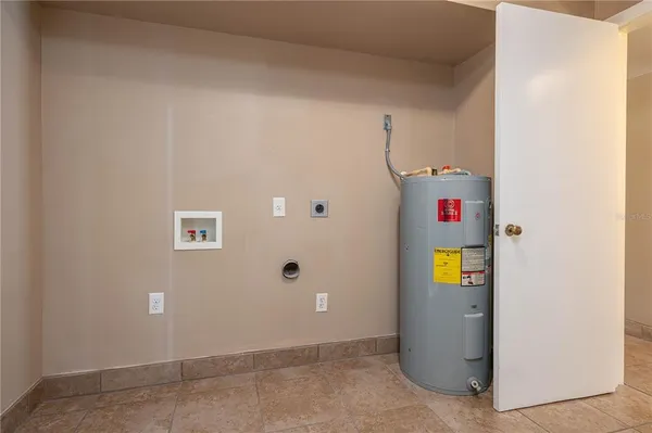 a view of an empty room with a fan