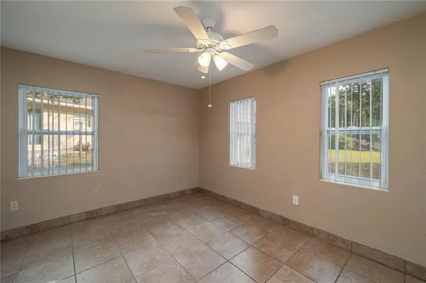 a view of an empty room with windows