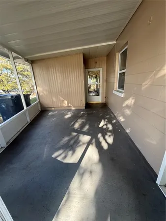 a view of a yard with a tree in the house