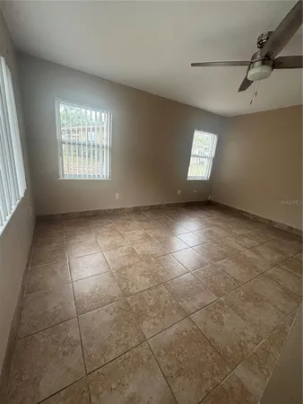 a view of an empty room with a window