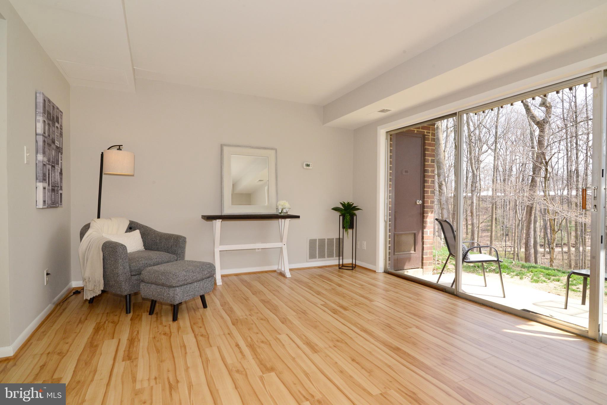 11623 Vantage Hill Road, Unit 1A Reston, VA 20190 - Photo 2 of 21 Living Room with Sliding Glass Doors to Patio.