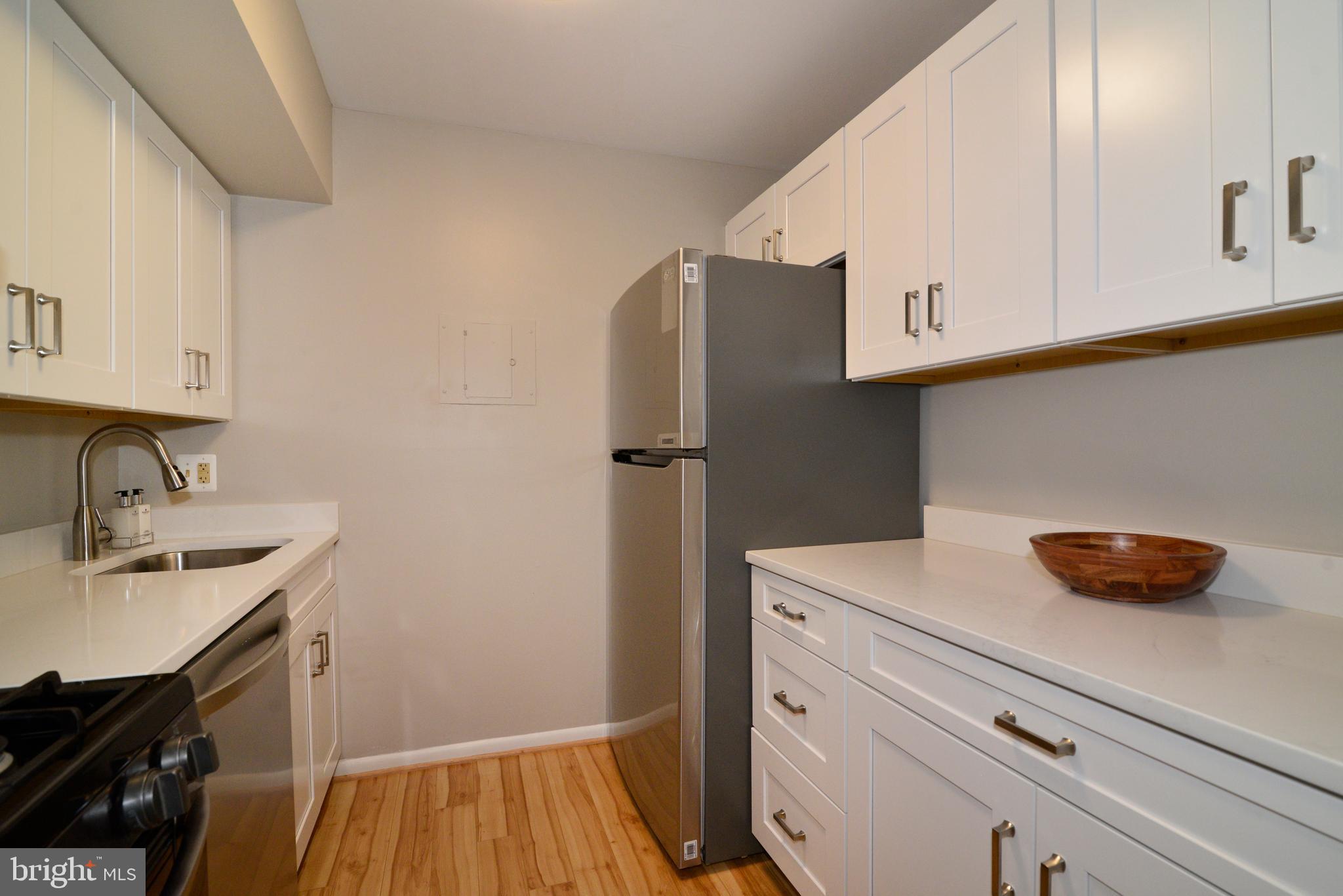11623 Vantage Hill Road, Unit 1A Reston, VA 20190 - Photo 3 of 21 Remodeled Kitchen: Quartz Countertops.