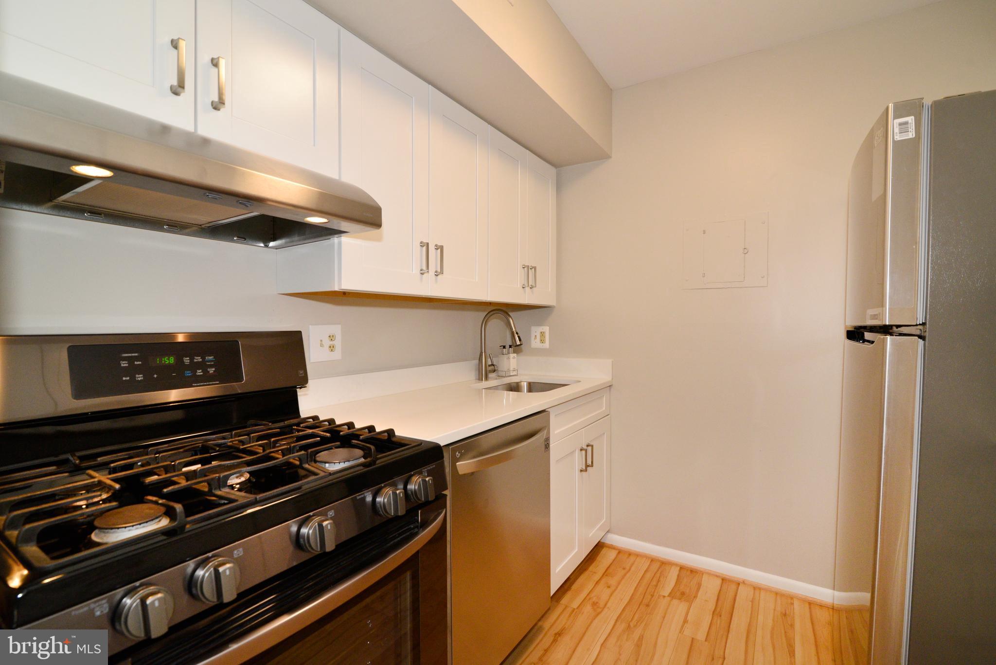 11623 Vantage Hill Road, Unit 1A Reston, VA 20190 - Photo 4 of 21 Remodeled Kitchen: New SS Appliances.