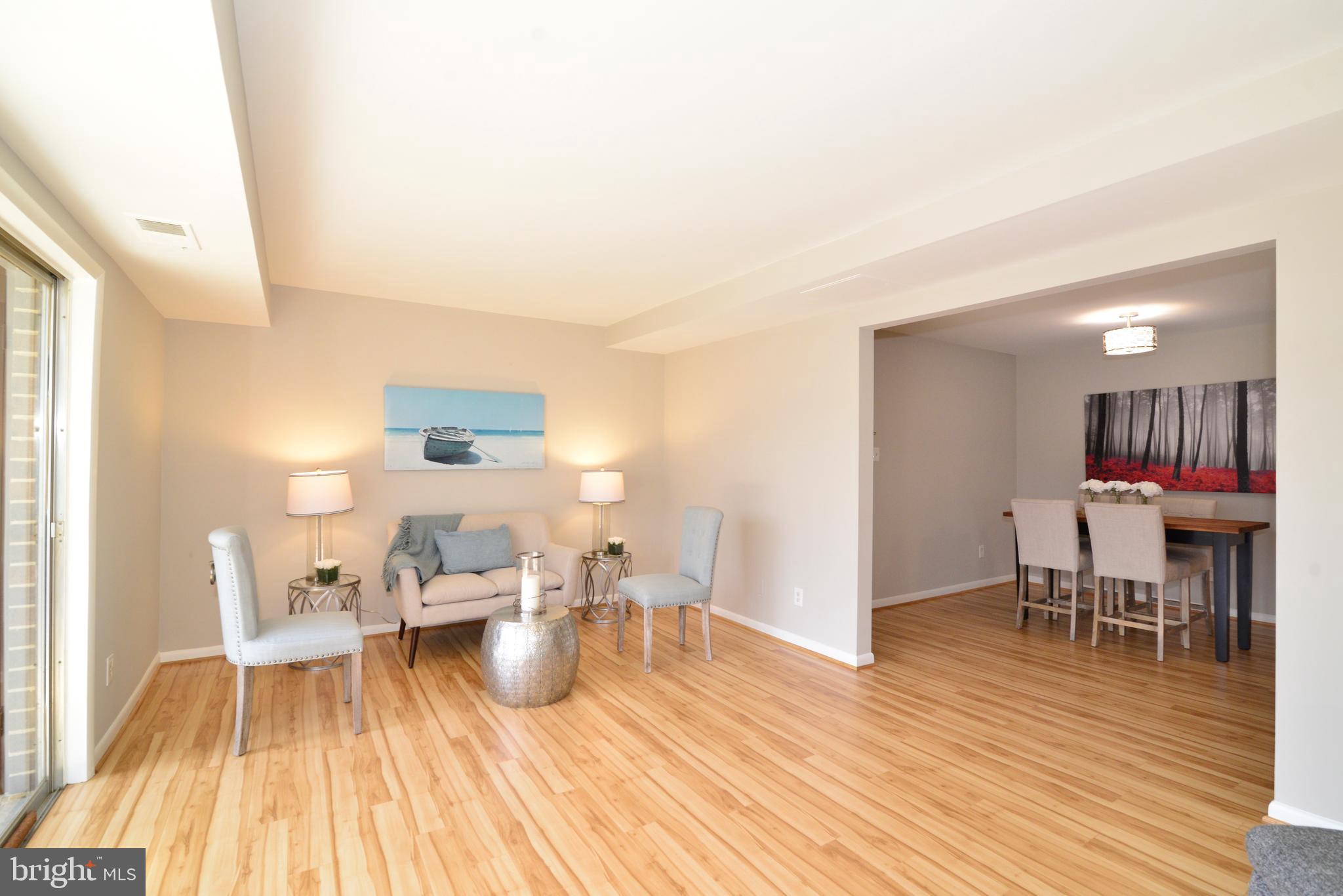 11623 Vantage Hill Road, Unit 1A Reston, VA 20190 - Photo 10 of 21 Living Room and Dining Room.