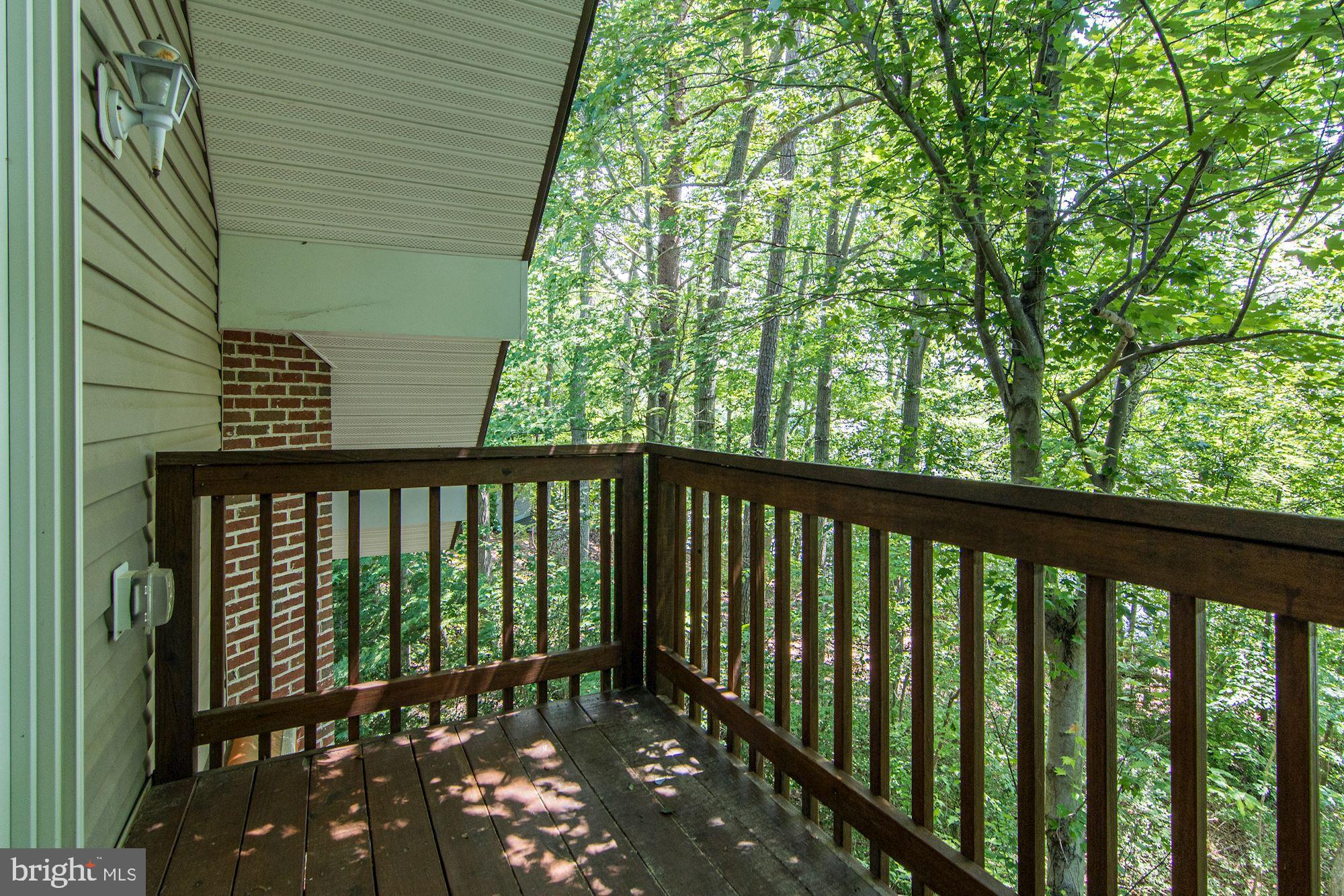 13088 Soundings Road Lusby, MD 20657 - Photo 22 of 42 Private deck nestled in the trees overlook creek