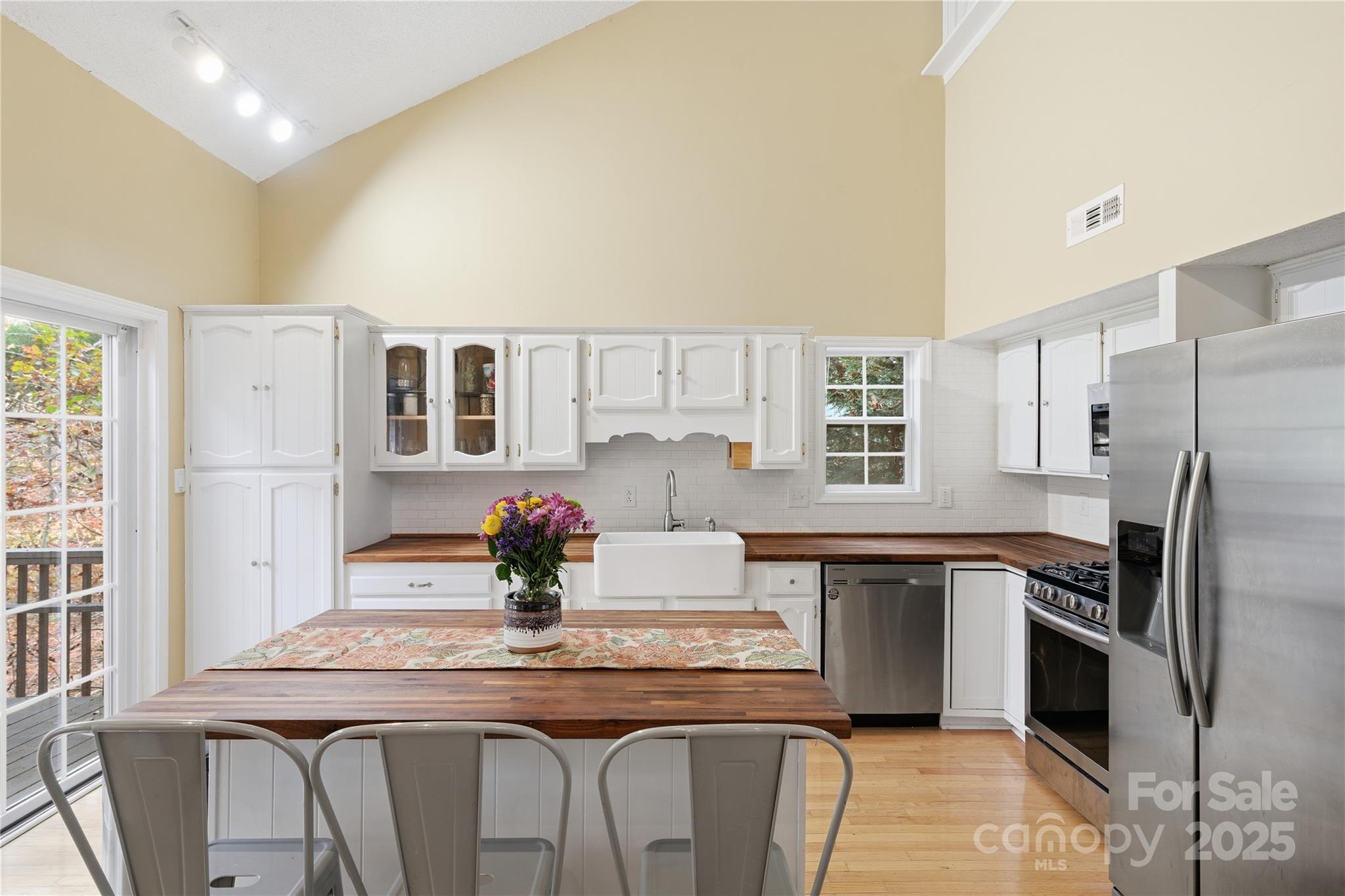 27071 Catamaran Drive Tega Cay, SC 29708 - Photo 13 of 30 a kitchen with stainless steel appliances granite countertop a sink and refrigerator