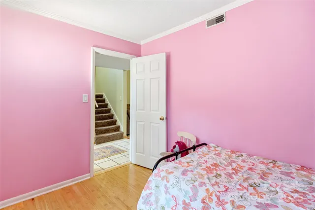 a bedroom with a bed and a backyard