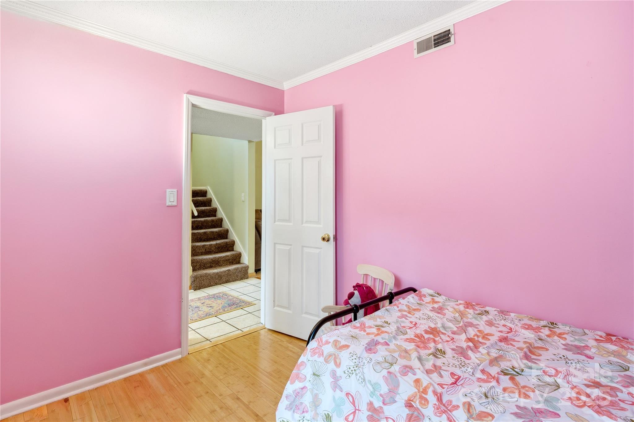 27071 Catamaran Drive Tega Cay, SC 29708 - Photo 15 of 30 a bedroom with a bed and a backyard