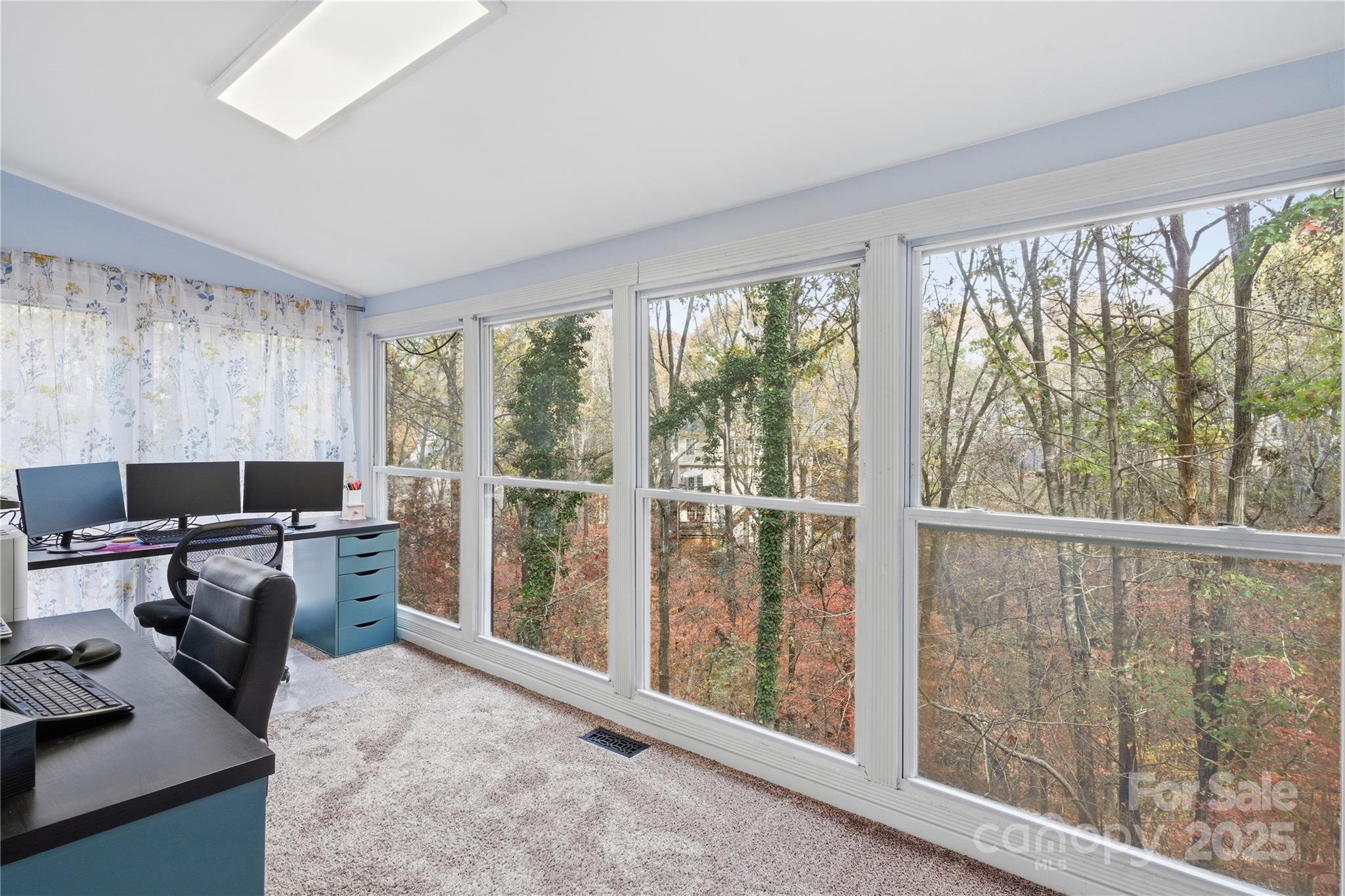 27071 Catamaran Drive Tega Cay, SC 29708 - Photo 17 of 30 a view of a livingroom with workspace and a large window