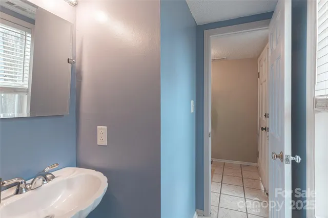 a bathroom with a sink and mirror