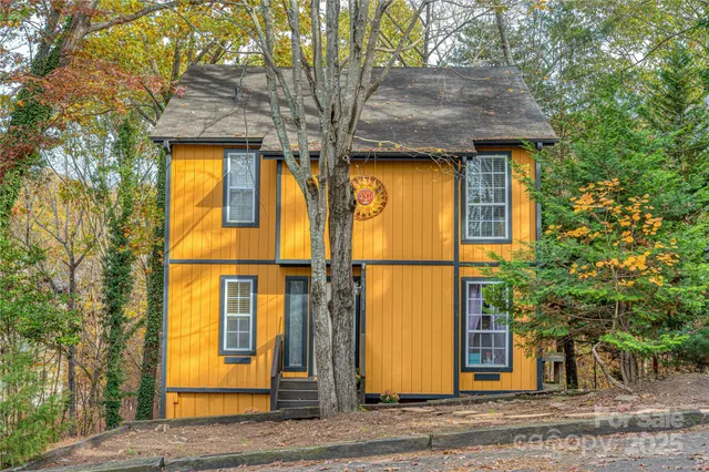 a view of a house with a tree