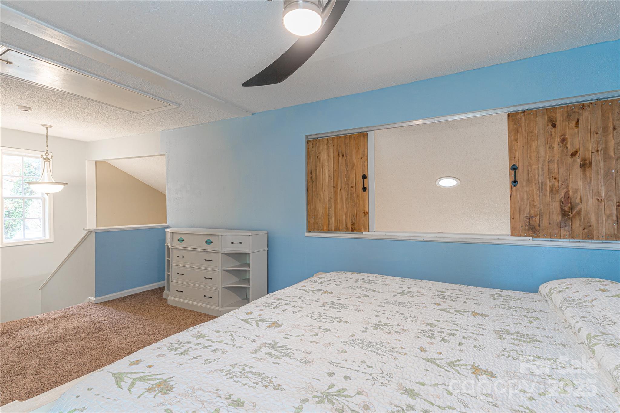 27071 Catamaran Drive Tega Cay, SC 29708 - Photo 23 of 30 a bedroom with a bed and a window