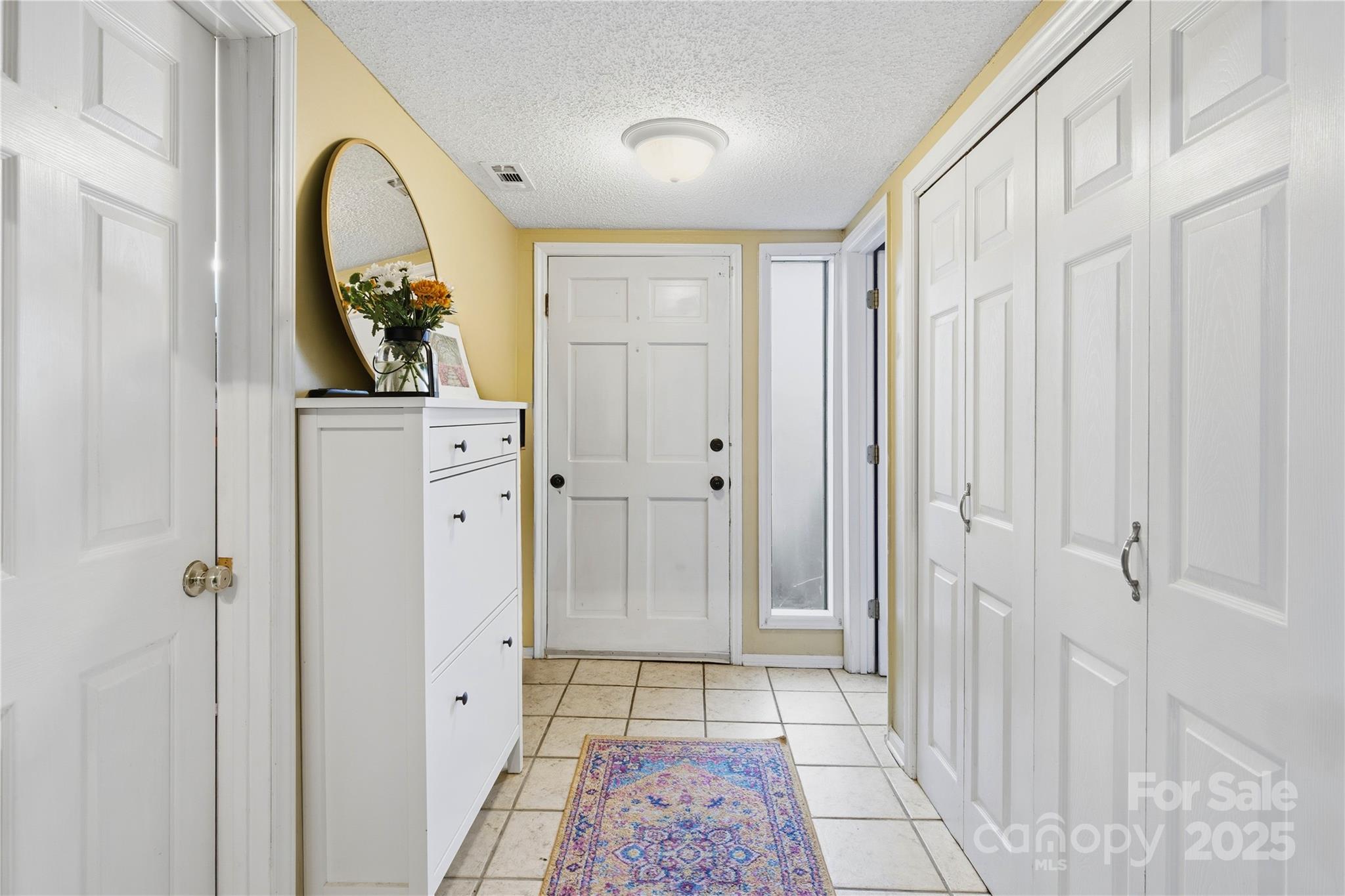 27071 Catamaran Drive Tega Cay, SC 29708 - Photo 4 of 30 a view of an entryway with wooden floor