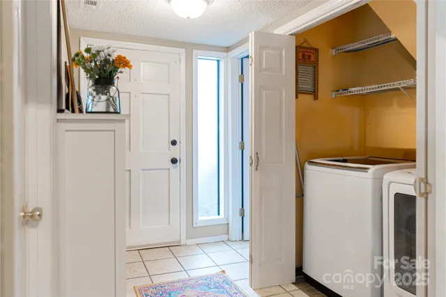 a view of a bedroom with closet and a window