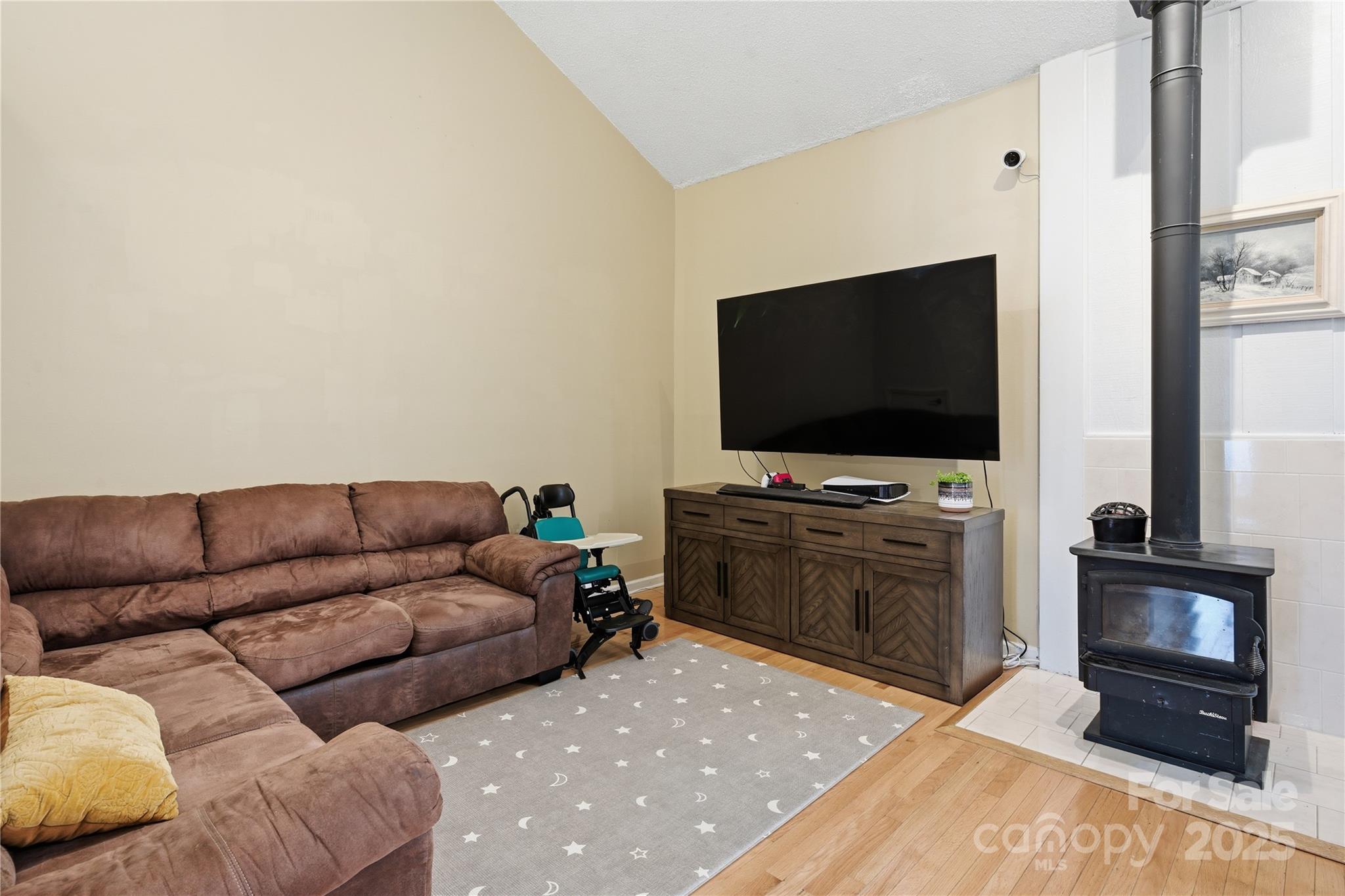 27071 Catamaran Drive Tega Cay, SC 29708 - Photo 6 of 30 a living room with furniture and a flat screen tv