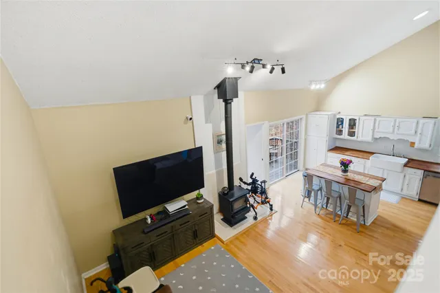 a view of a livingroom with furniture and a flat screen tv