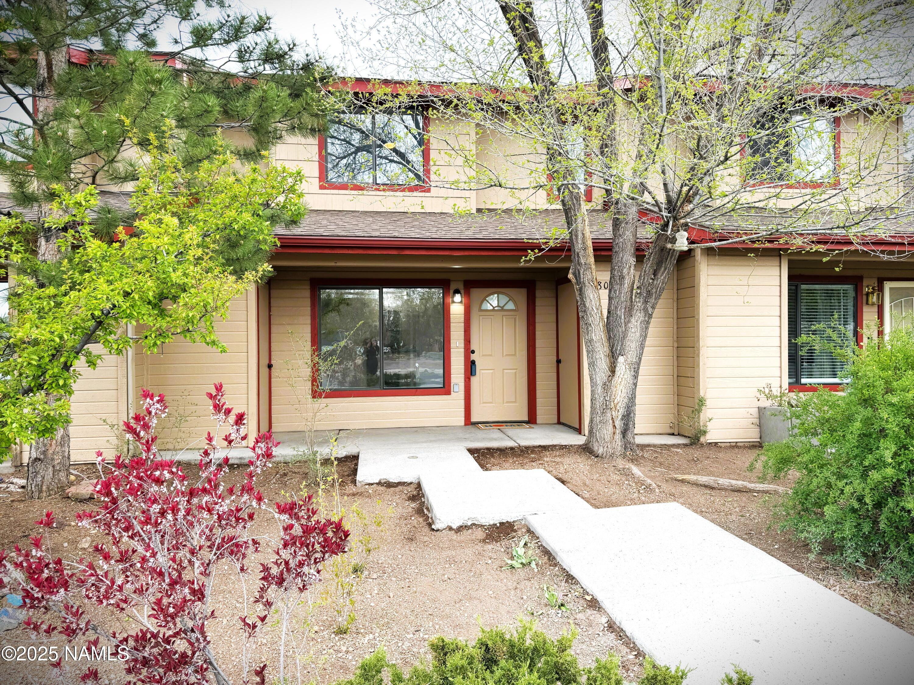 front view of a house with a potted plant