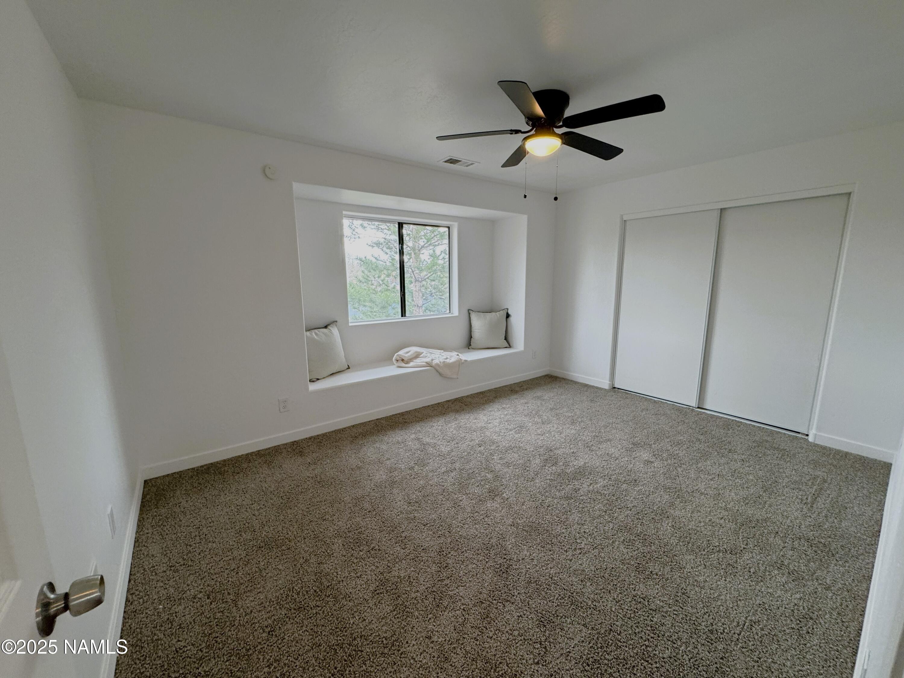 1807 North Main Street Flagstaff, AZ 86004 - Photo 18 of 26 a view of room with window and ceiling fan