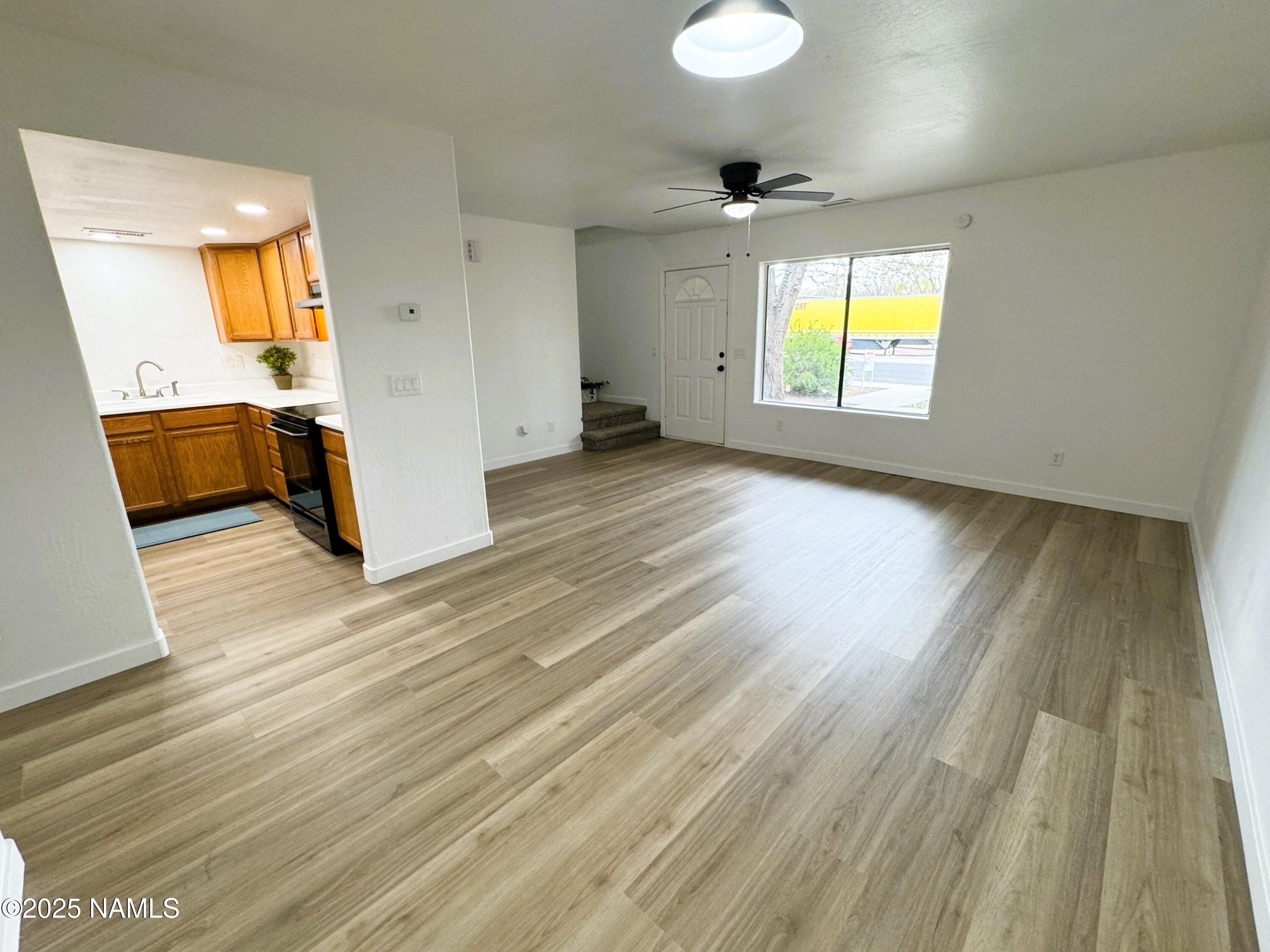 1807 North Main Street Flagstaff, AZ 86004 - Photo 7 of 26 wooden floor in an empty room with a window