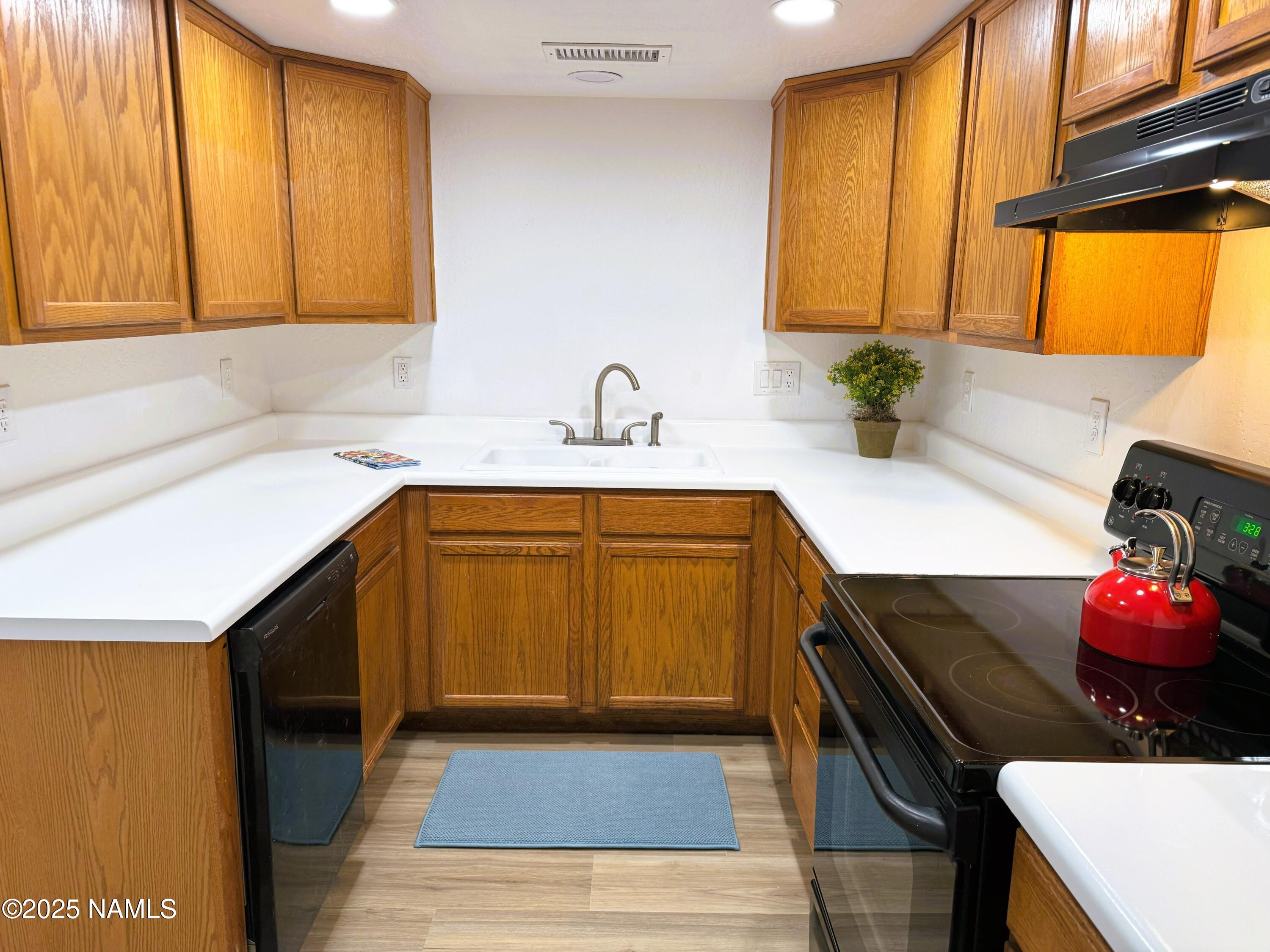 1807 North Main Street Flagstaff, AZ 86004 - Photo 8 of 26 a kitchen with a sink and cabinets