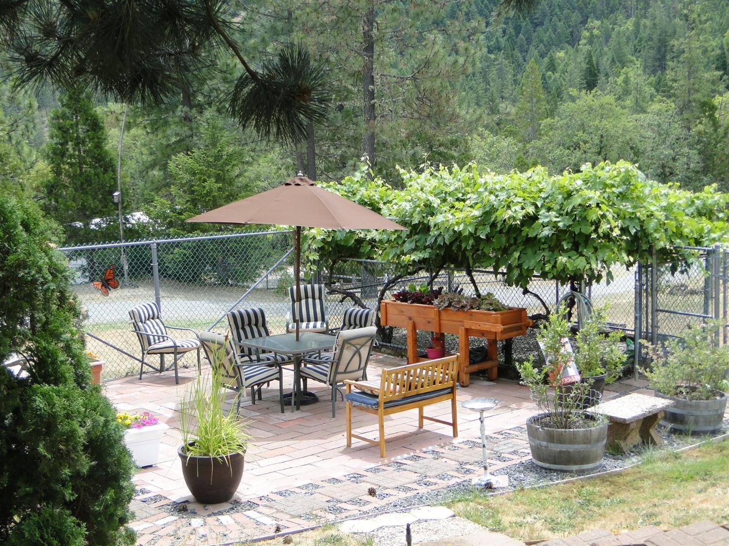 2000 Limpy Creek Road Grants Pass, OR 97527 - Photo 4 of 35 a view of a patio with furniture and potted plants