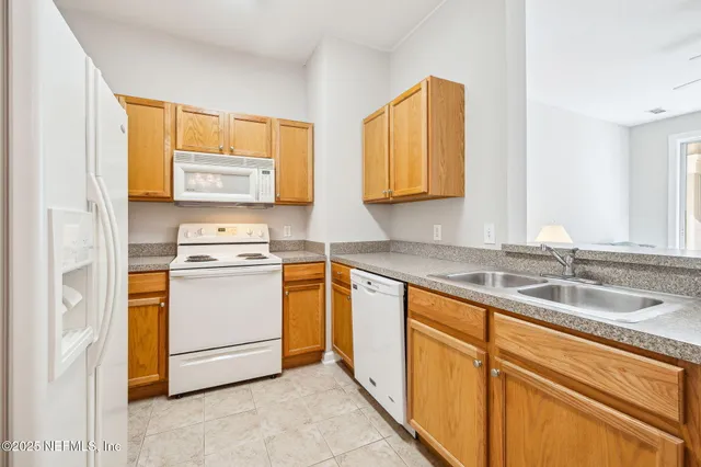 a view of a kitchen with a sink