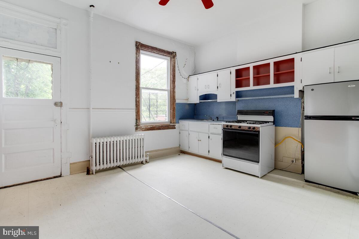 2739 North Calvert Street Baltimore, MD 21218 - Photo 17 of 61 Unit 1 Floor 1: Kitchen with access to fire escape