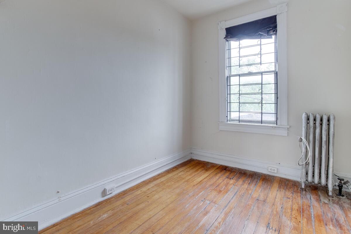 2739 North Calvert Street Baltimore, MD 21218 - Photo 39 of 61 Unit 3 Floor 3: Bedroom 1, access to fire escape