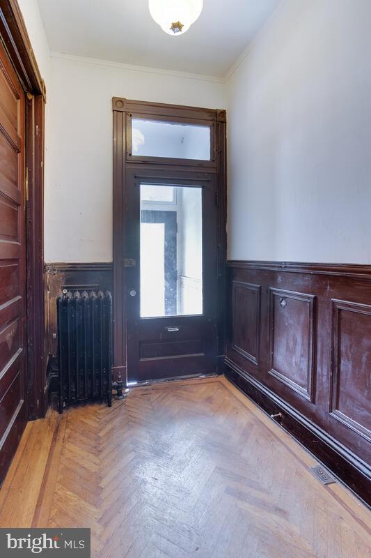 2739 North Calvert Street Baltimore, MD 21218 - Photo 6 of 61 Original wood details in foyer/hallway