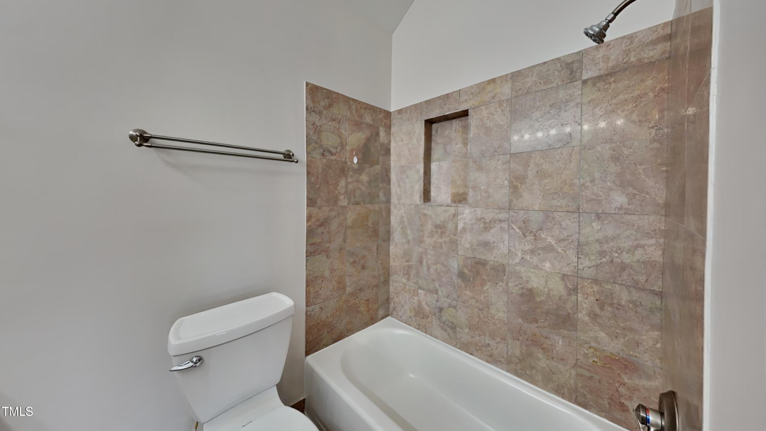 428 South Meadow Road Raleigh, NC 27603 - Photo 8 of 13 a bathroom with a shower and a toilet