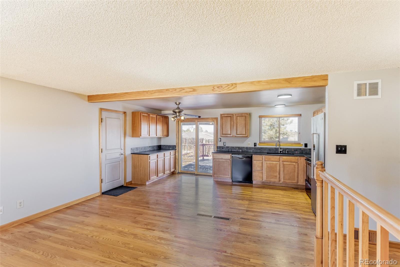 128 Olympus Circle Lone Tree, CO 80124 - Photo 16 of 35 a large kitchen with a table and chairs