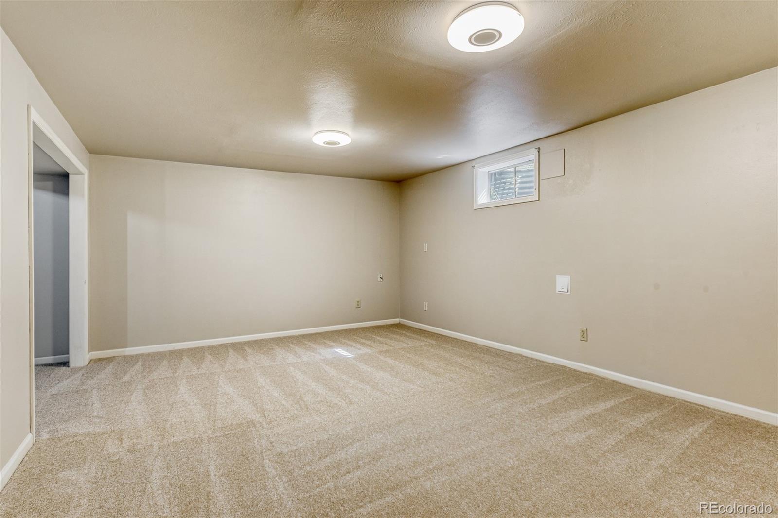 128 Olympus Circle Lone Tree, CO 80124 - Photo 18 of 35 an empty room with a workbench