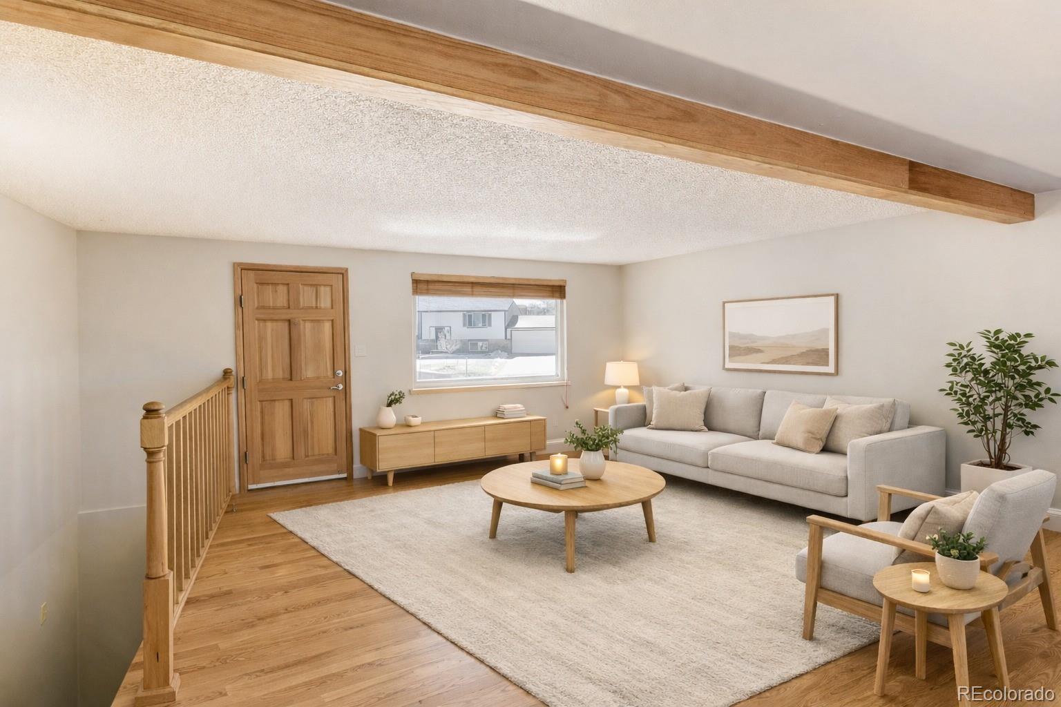 128 Olympus Circle Lone Tree, CO 80124 - Photo 2 of 35 a living room with furniture and a window
