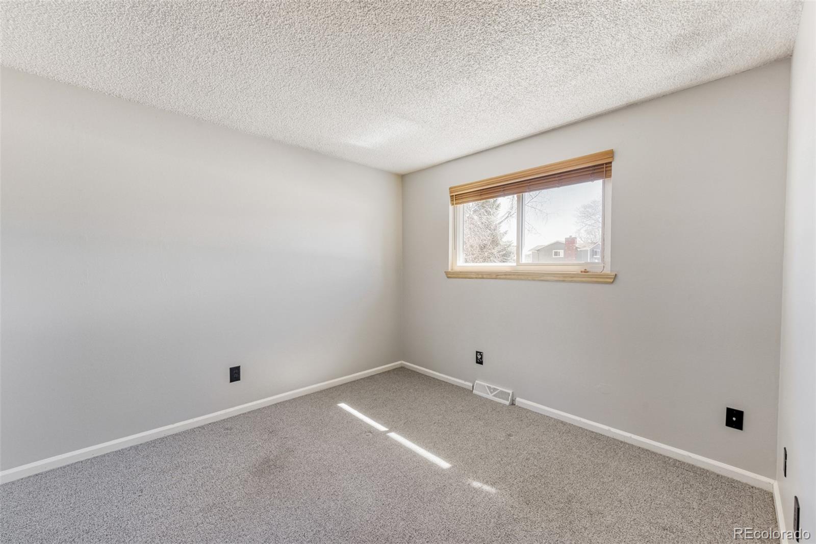 128 Olympus Circle Lone Tree, CO 80124 - Photo 21 of 35 a view of an empty room with a window
