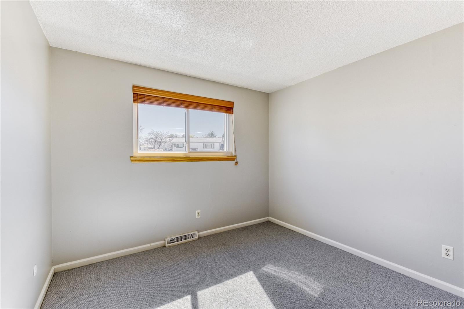 128 Olympus Circle Lone Tree, CO 80124 - Photo 22 of 35 a view of an empty room with a window