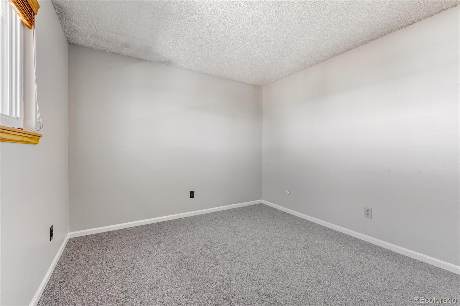 128 Olympus Circle Lone Tree, CO 80124 - Photo 24 of 35 an empty room with a window