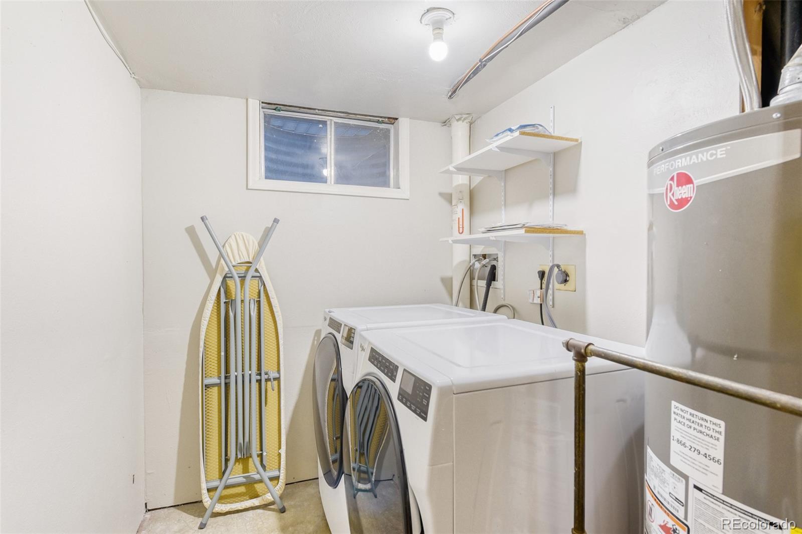 128 Olympus Circle Lone Tree, CO 80124 - Photo 29 of 35 a utility room with dryer and washer