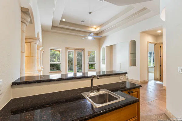 a view of a big room with windows and brick walls