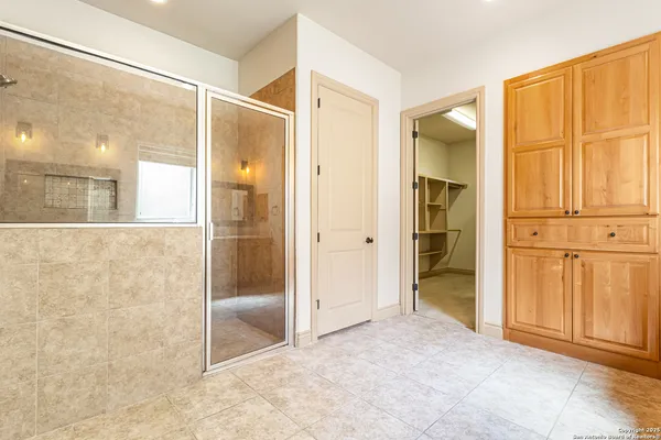 an empty room with closet area