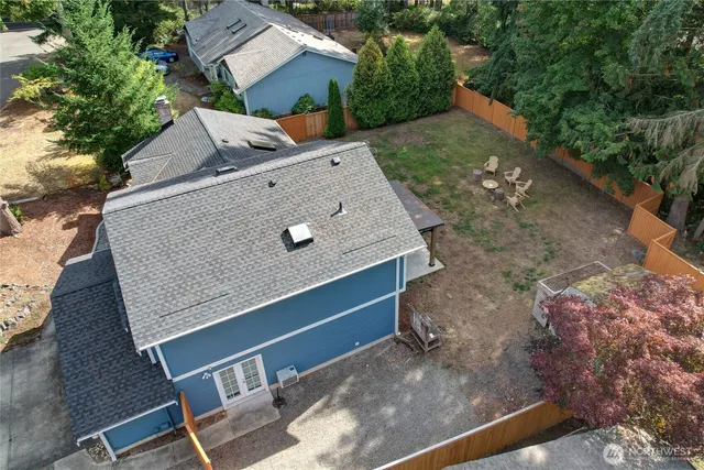 a aerial view of a house with a yard