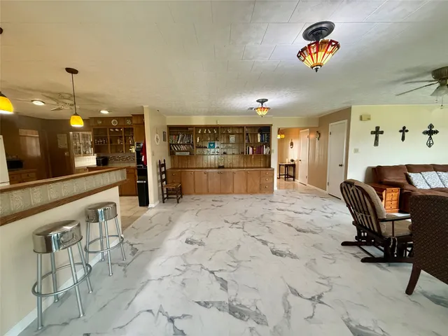 a room with furniture and a flat screen tv